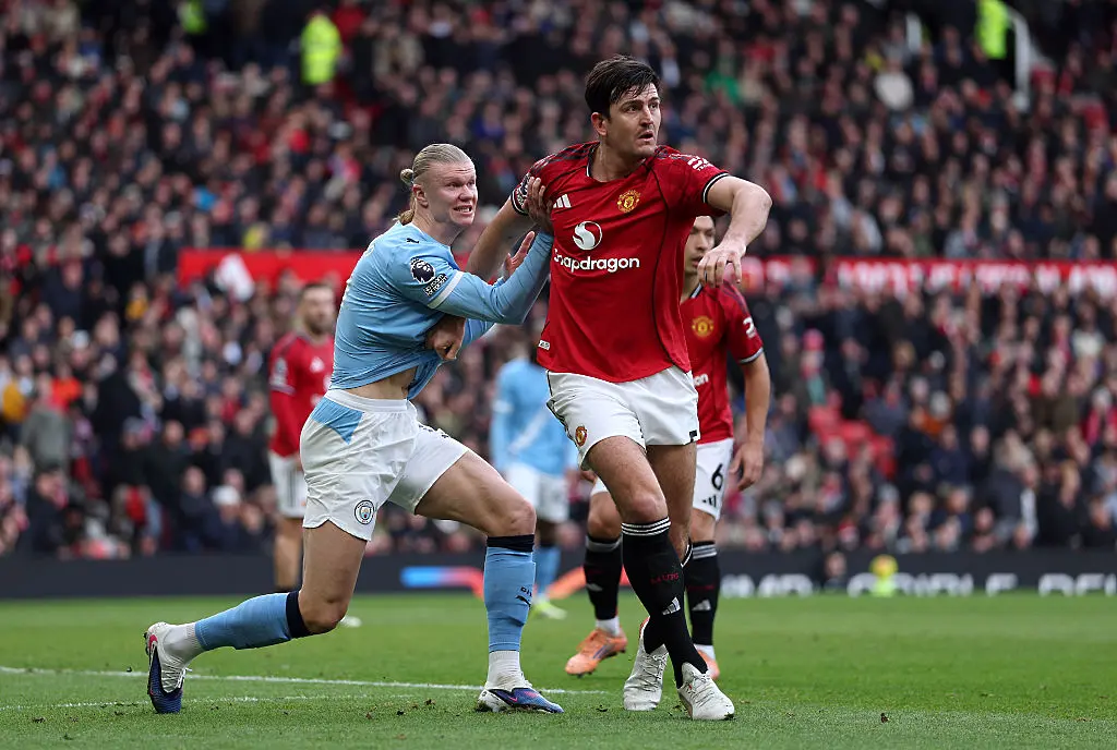 Ерлинг Холанд и Хари Магуайър / Getty Images 